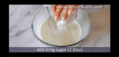 icing sugar is added to whipped cream