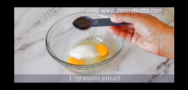 adding eggs, sugar and vanilla in bowl