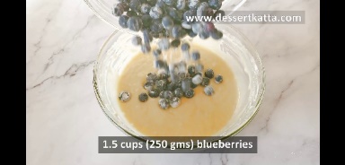 adding blueberries to make lemon blueberry muffins