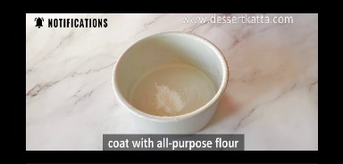all-purpose flour is added to the baking pan to coat the pan.