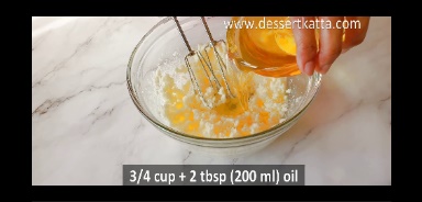 oil is added to butter and sugar mixture in a glass bowl