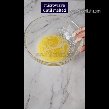 Big glass bowl contains melted butter