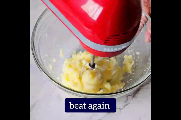 butter and sugar is beaten using hand beater