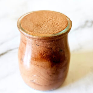 chocolate mousse made with cocoa powder placed in serving glass