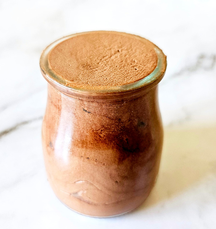 chocolate mousse made with cocoa powder placed in serving glass
