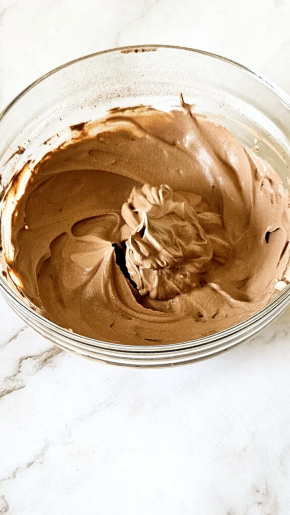 perfectly whipped chocolate mousse is kept in glass bowl