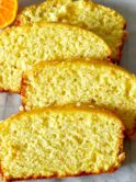 orange loaf cake slices kept on parchment paper