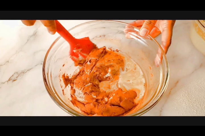 gently folding the batter after adding milk