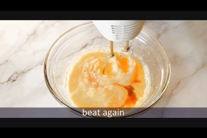 beating the marble loaf cake batter after adding vanilla extract