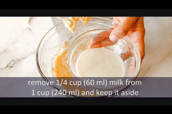 removing 60 milk from 240 ml to add in chocolate cake batter while making marble load cake recipe