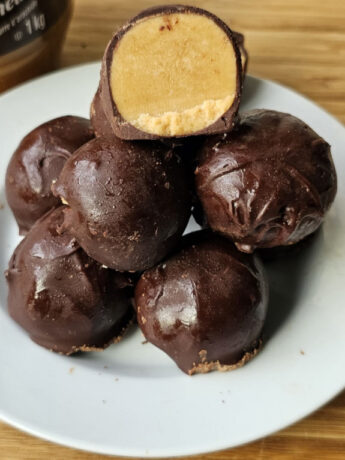 stacked peanut butter truffles showing texture from inside