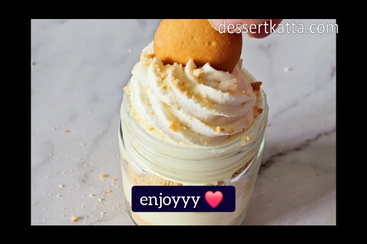 pudding is decorated with nilla wafer on top of whipping cream