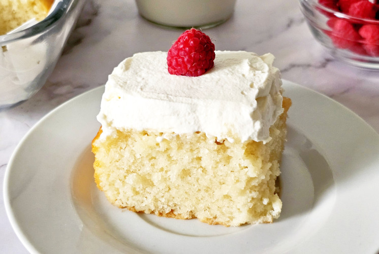 eggless tres leches cake served on small white plate