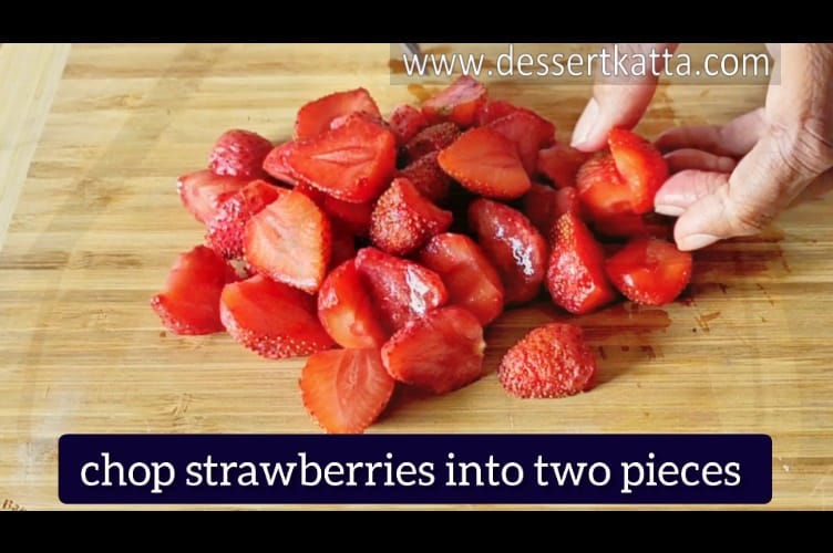 chopping strawberries for strawberry crumble