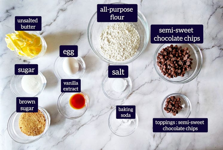 Pizza hut cookie ingredients are placed on marble surface in an individual bowl