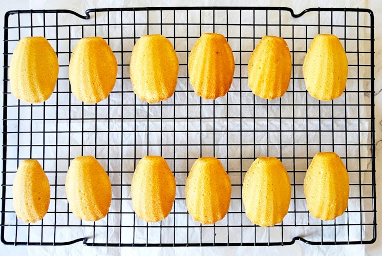 fresh Starbucks madeleines kept on wire rack