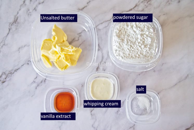 American buttercream frosting ingredients are placed on marble background