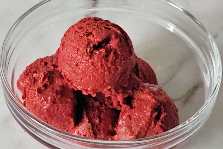 red velvet ice cream scoops served in glass bowl