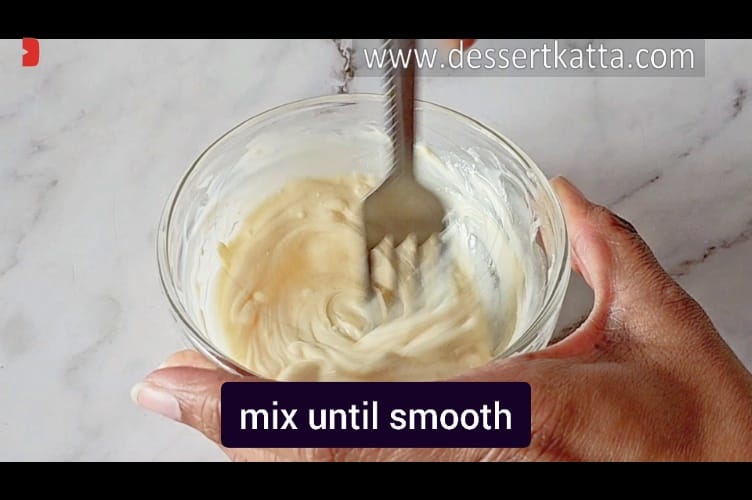 mixing melted white chocolate with form until it is smooth