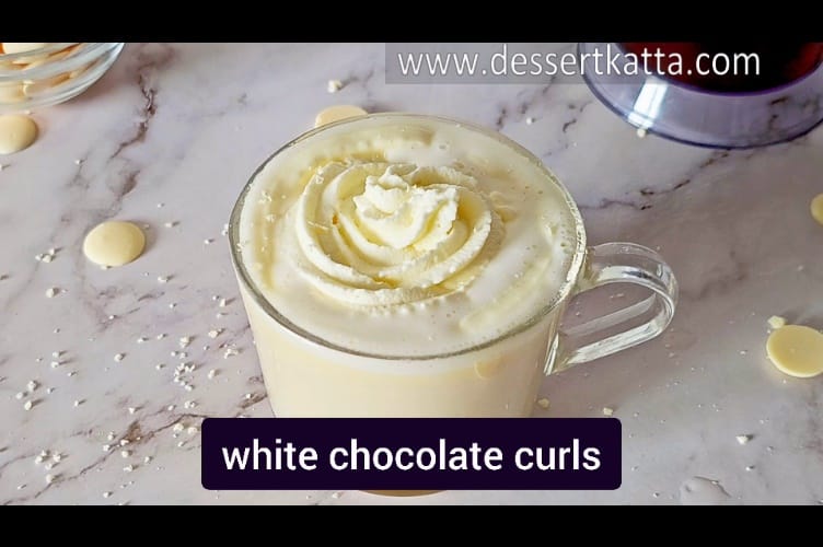 adding few white chocolate curls on top of the white chocolate mocha