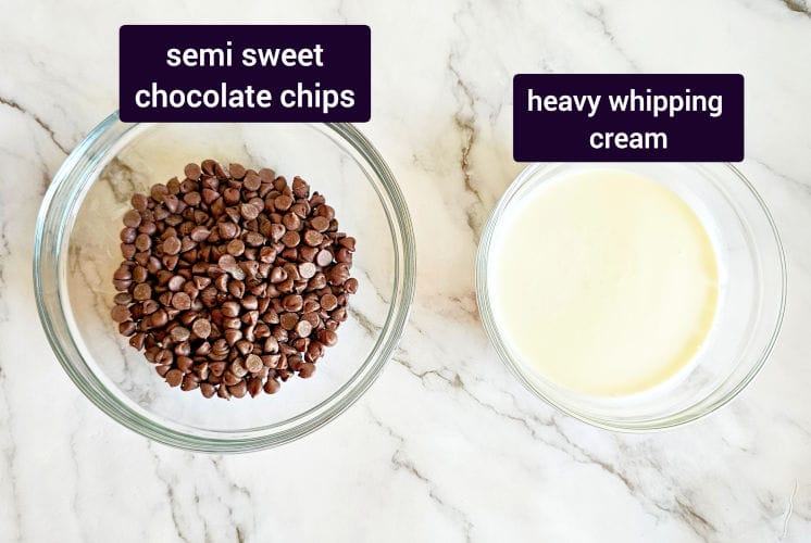 chocolate ganache ingredients placed on marble surface in individual bowls