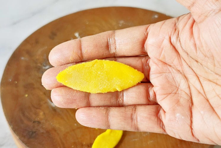 a picture of maggianos lemon cookie placed on hand and showing its shape